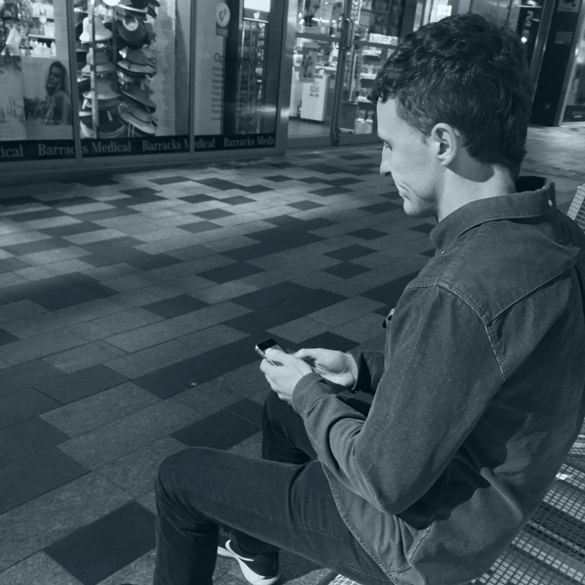 Chatloop volunteer sending a text message to a language learner from her kitchen